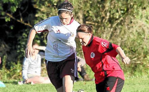 Boambee’s Kylie MacDonald and Amanda Pithers from Coffs United battle for the ball at Ayrshire Park on Saturday. Boambee’s Kylie MacDonald and Amanda Pithers from Coffs United battle for the ball at Ayrshire Park on Saturday.